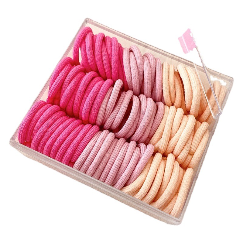 Base de banda de pelo pulgar de los niños base 90 bandas de goma cuerda de pelo para niños color caja de pelo cuerda cabeza accesorios al por mayor