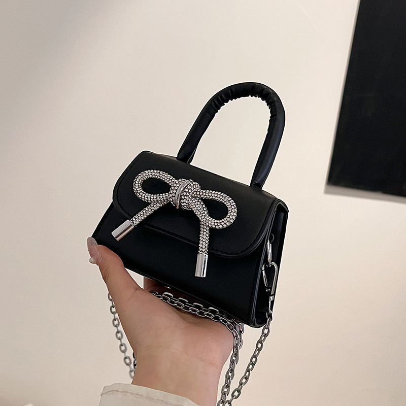 Moda al por mayor arco mini bolso mujer 2025 nuevo mochila bolso de hombro universal bolso de moda mujer