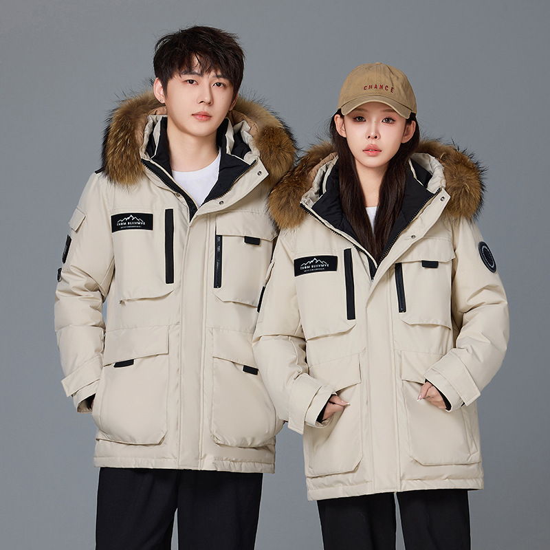 Invierno transfronterizo nueva chaqueta de plumón hombre y mujer largo al aire libre frío extremo engrosado pareja superando la chaqueta de trabajo