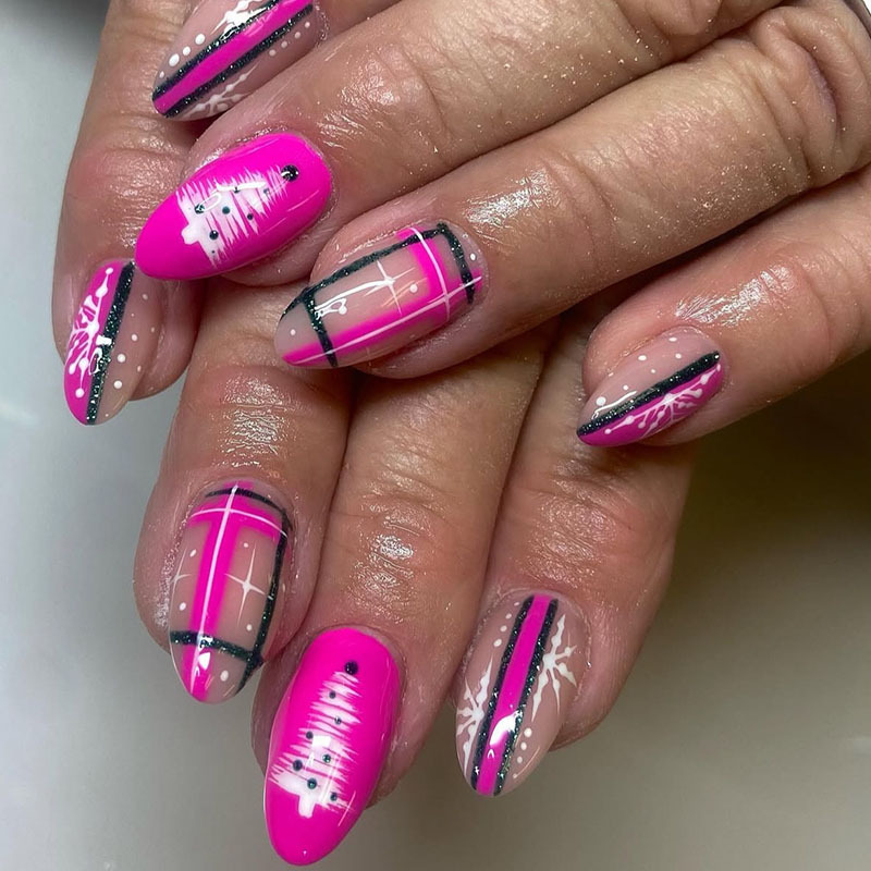 Medium almond-shaped Christmas manicure with glitter stripes, pink nails, Christmas tree and snowflake designs, Y2K style for trendy girls