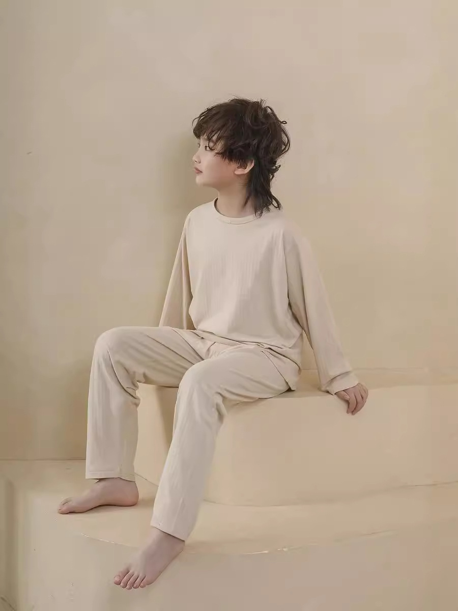 Nuevo suelto de cuello redondo para niños pijamas de manga larga set de algodón otoño y invierno ropa de hogar para niños y niñas pijamas