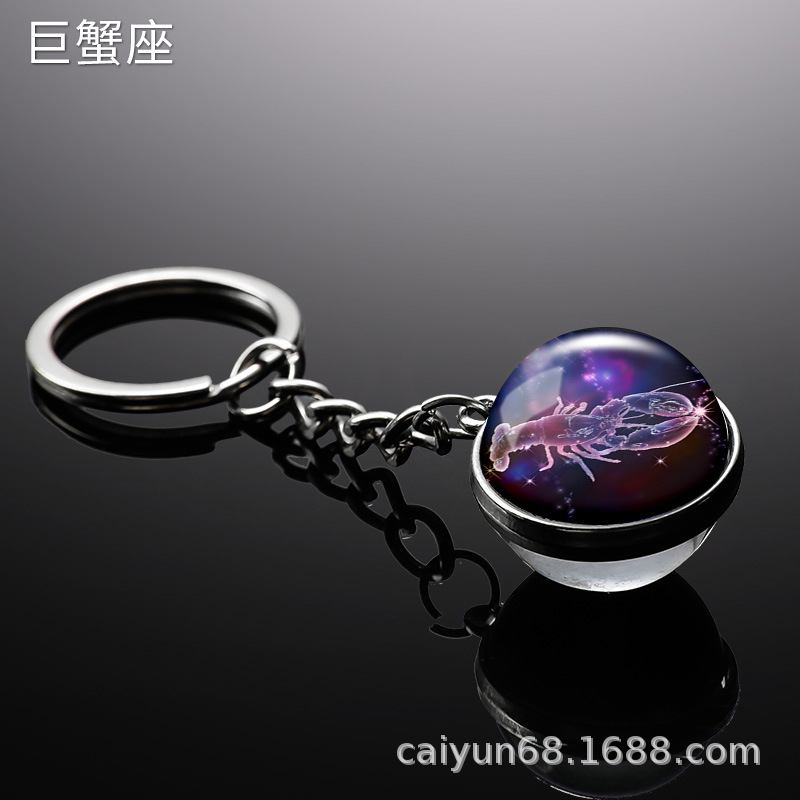 Transfronterizo 12 constelaciones de luz nocturna bolsos colgantes de bolsas de joyas de tiempo doble cara bola de vidrio llavero al por mayor