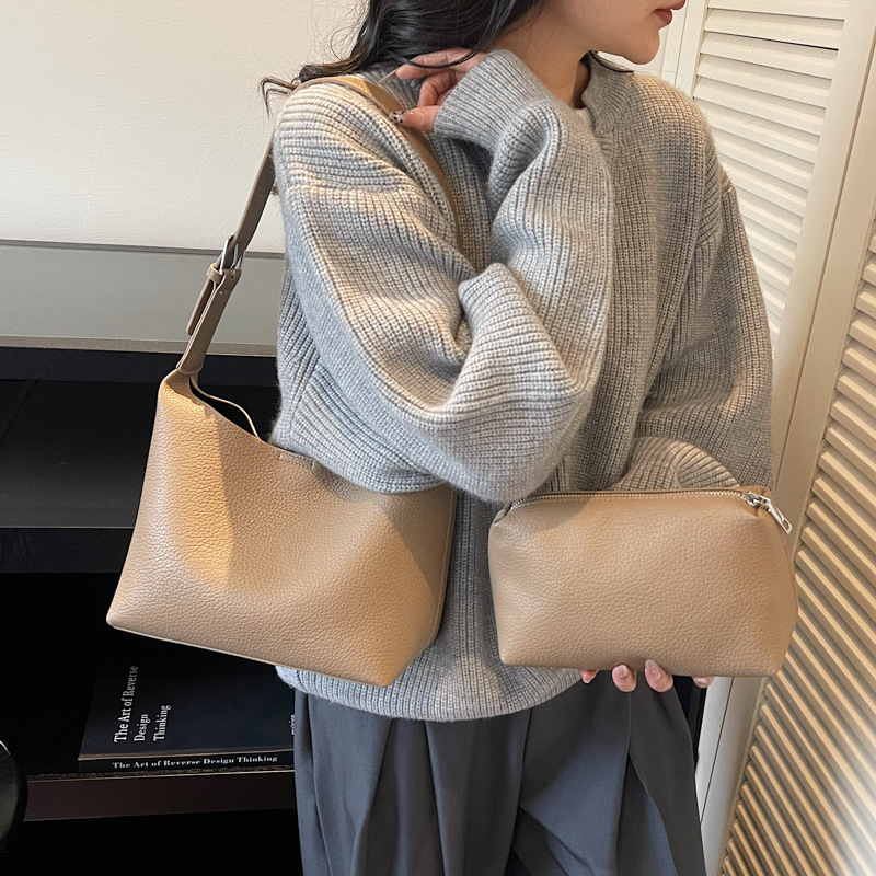 Bolsos de cubo retro de alta calidad para mujeres otoño / invierno 2025 nuevo nicho Zhong commuting mochila de hombro bolso de trabajo diario