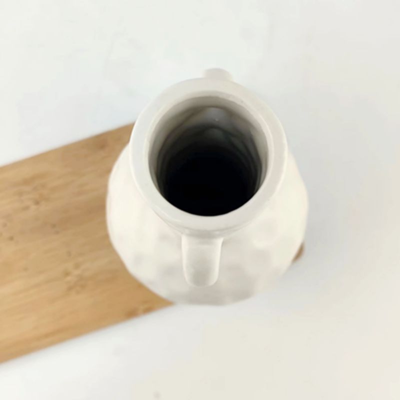 Florero binaural blanco minimalista moderno transfronterizo, decoración de mesa de comedor de casa de familia de cerámica de alta gama, decoración creativa