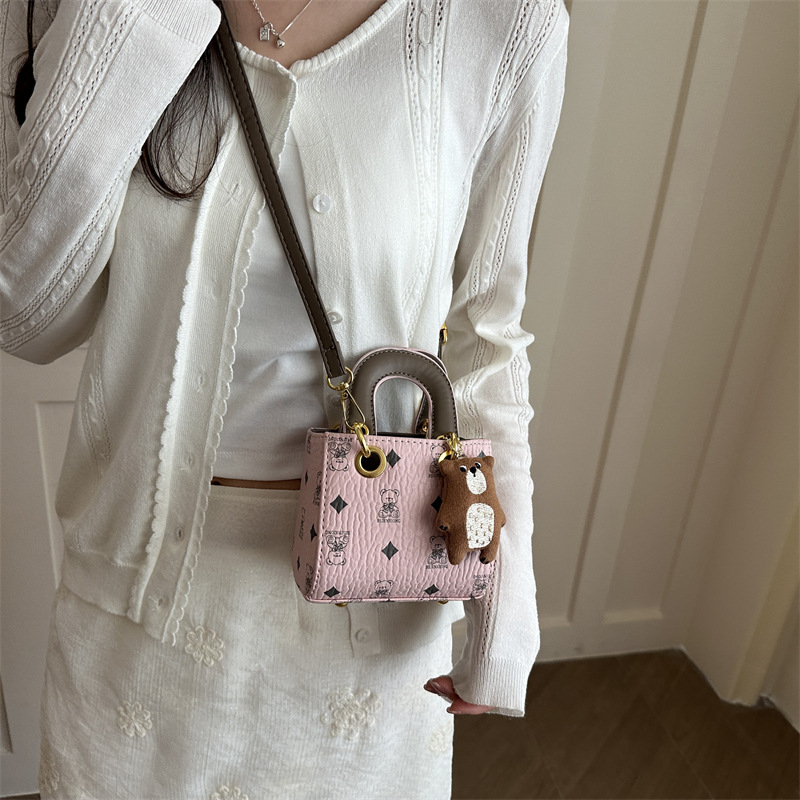 2026 nuevo bolso infantil caricatura lindo oso impresión bolso de hombro de moda mini bolso de bebé