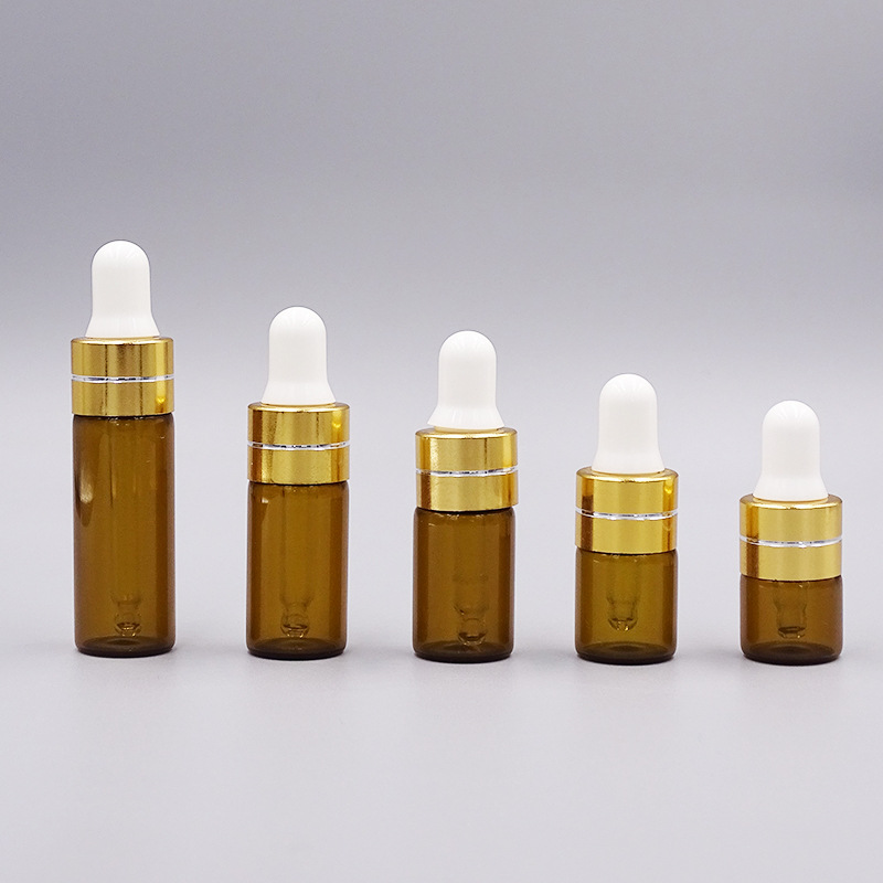 1ml una pieza 3528; botella de color marrón con anillo de oro tangente; vidrio