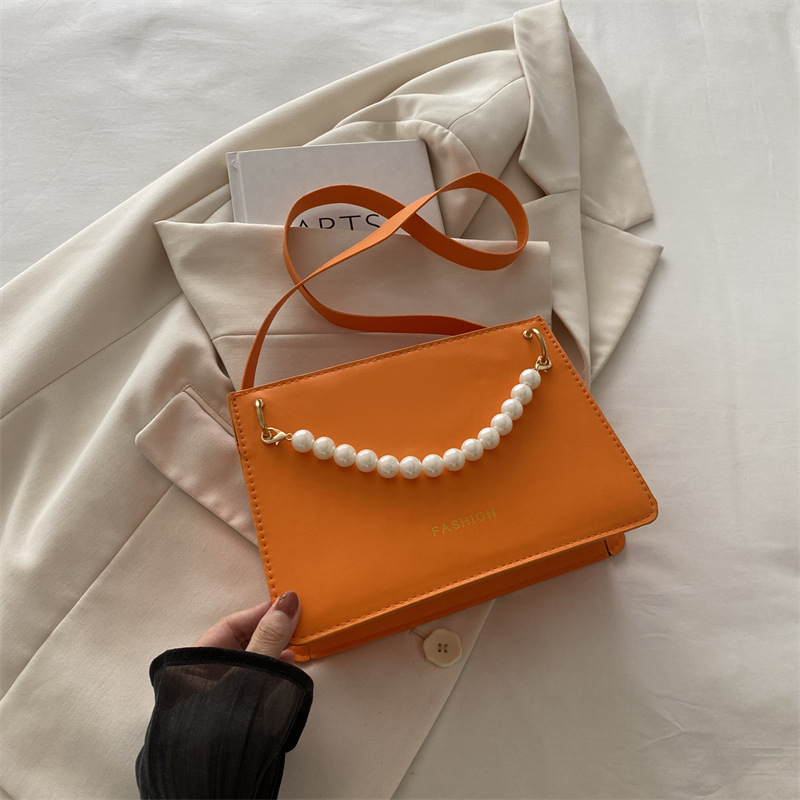 Bolso de nicho de sentido de alta gama para mujer 2024 nuevo bolso de hombro de cadena de perlas de moda salvaje bandolera bandolera