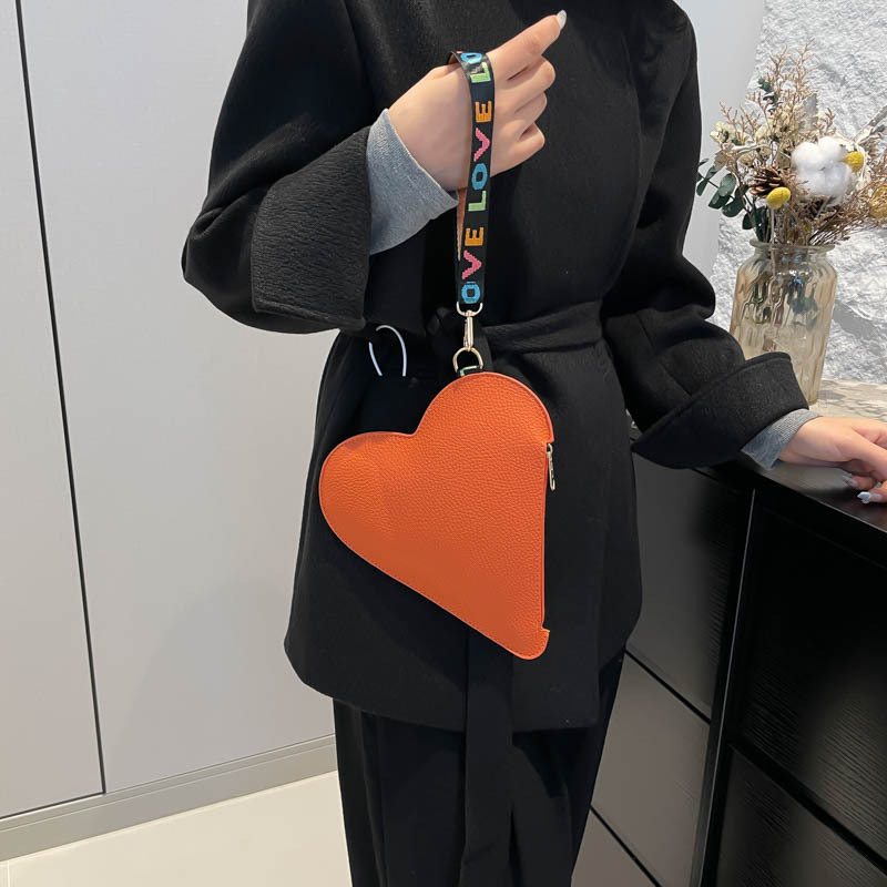 Nicho de diseño amor 2025 primavera nuevo alto valor facial este año popular bolsos de cambio bolsos de mano bolsos de mujer coreana moda