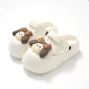 White Crocs-style slippers with butterfly