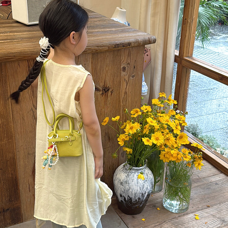 Bolsos de mano para niños lindos colgantes extranjeros mini bolsos de hombro para niños y niñas de color sólido simple bolsos de conchas de niños de moda