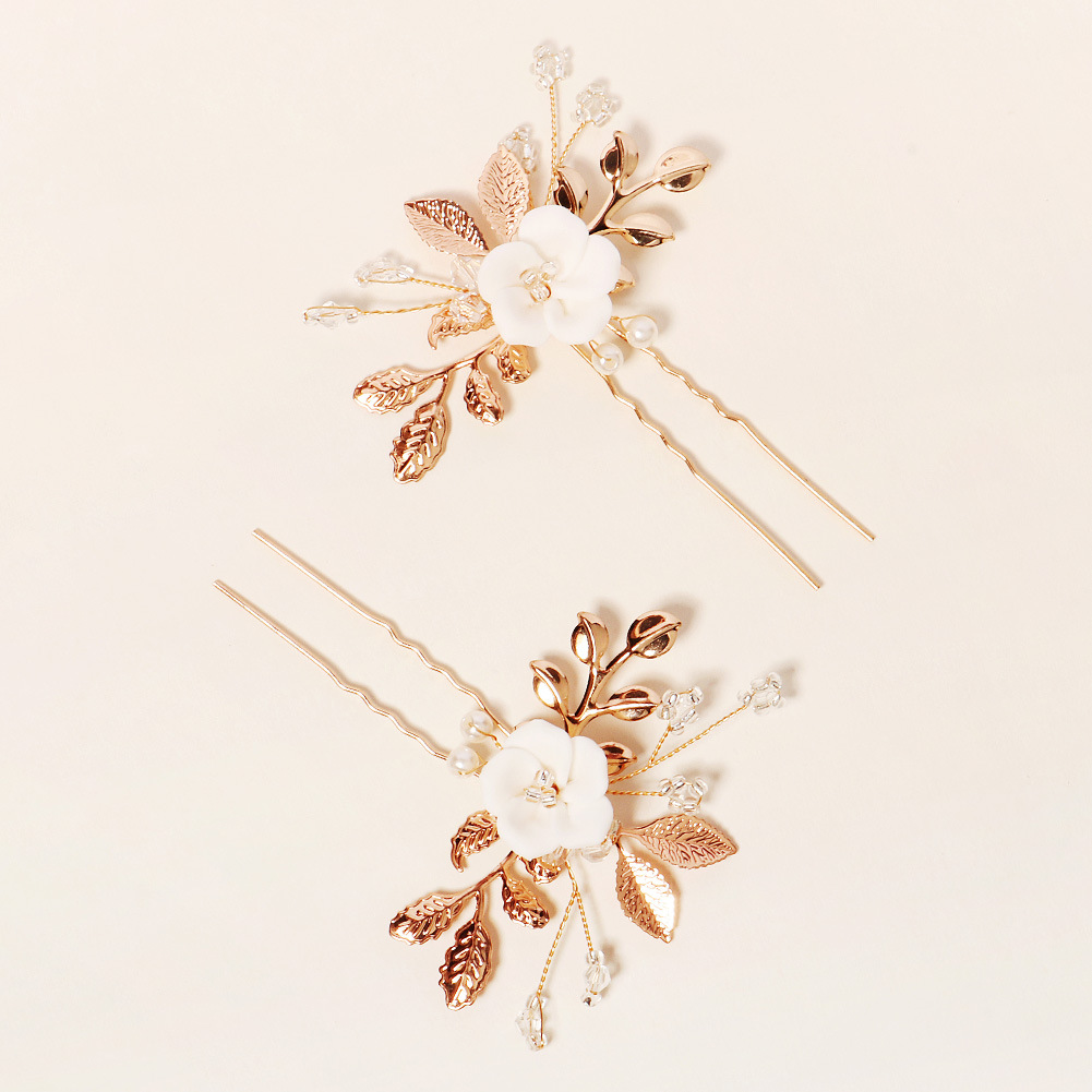 Nouveau Nuptiale Ornement D'or Feuille Perle Broches En Forme De U De Style Antique Chinois Han Vêtements Chignons Cheveux Accessoires En Céramique Fleur Épingle À Cheveux display picture 5