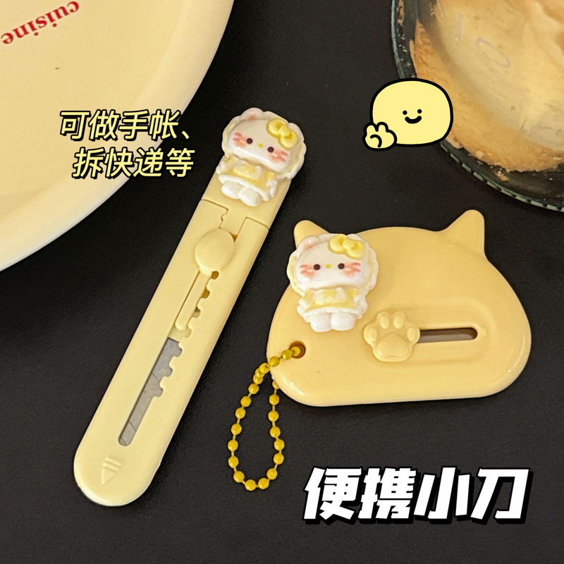 エクスプレスハンドブック切断用のかわいい猫のユーティリティナイフ、紙切断ナイフ、インクリームスタイルのポータブル箱開けナイフ卸売|undefined