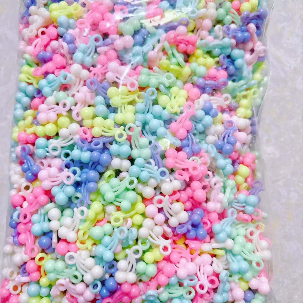 2025 Nuevas cuentas de cabello baratas en bolsa nuevas cuentas de plástico de color primavera diy gran agujero image 24
