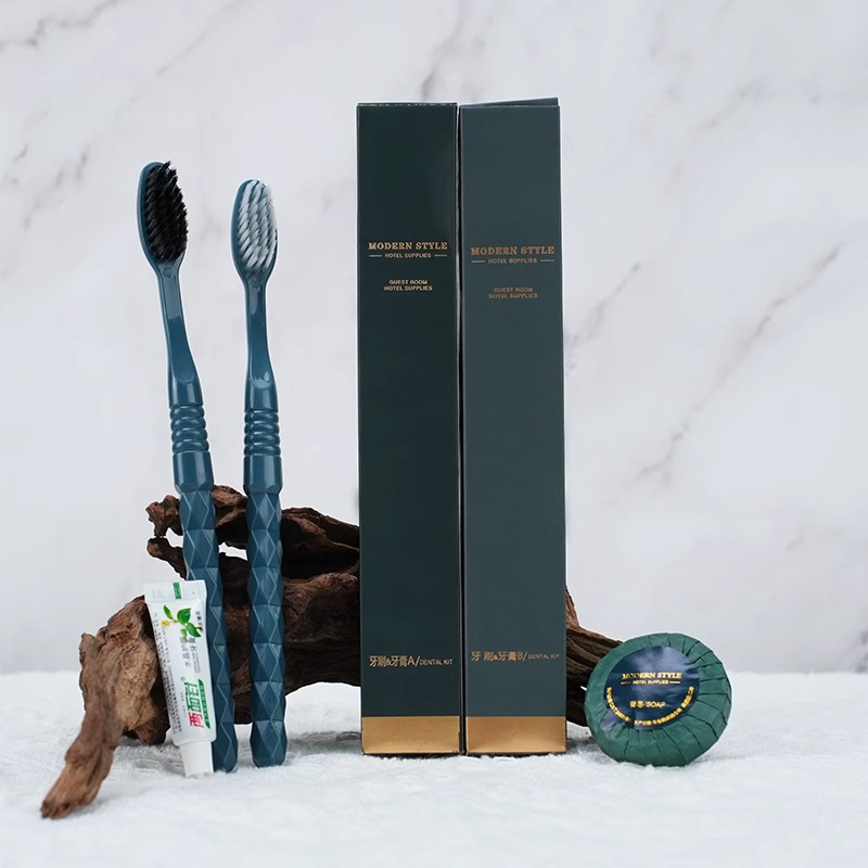Paper box set of disposable toothbrushes, toothpaste, and travel shower supplies, complete hotel consumables