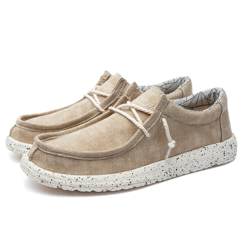 2025 al por mayor de primavera de mediana edad nuevos zapatos casuales de hombre zapatos de tela transpirables zapatos de lona PU ligeros zapatos de pedaleos