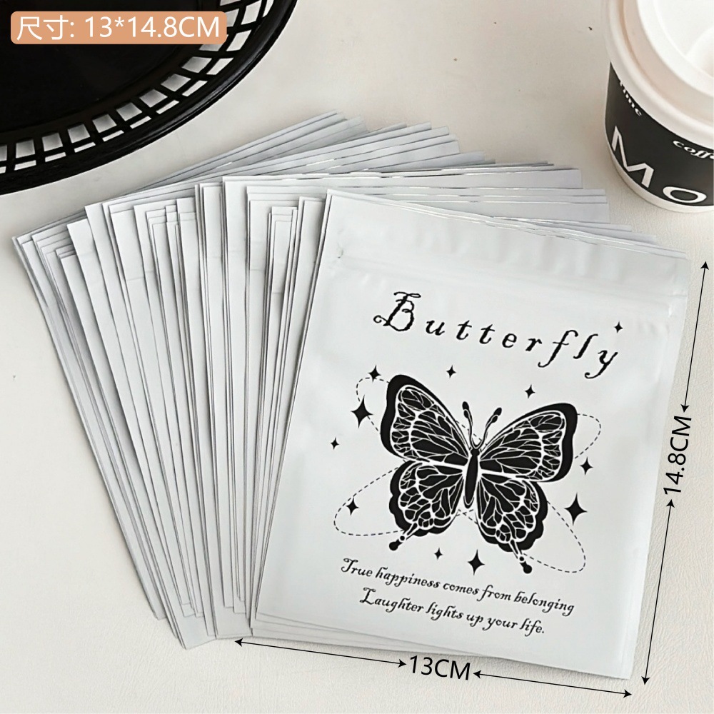 Bolsa de alto valor negro y blanco mariposa auto-sellada, pequeña bolsa de regalo, bolsa de embalaje de regalo, bolsa de sellado de viento, pequeña bolsa ciega