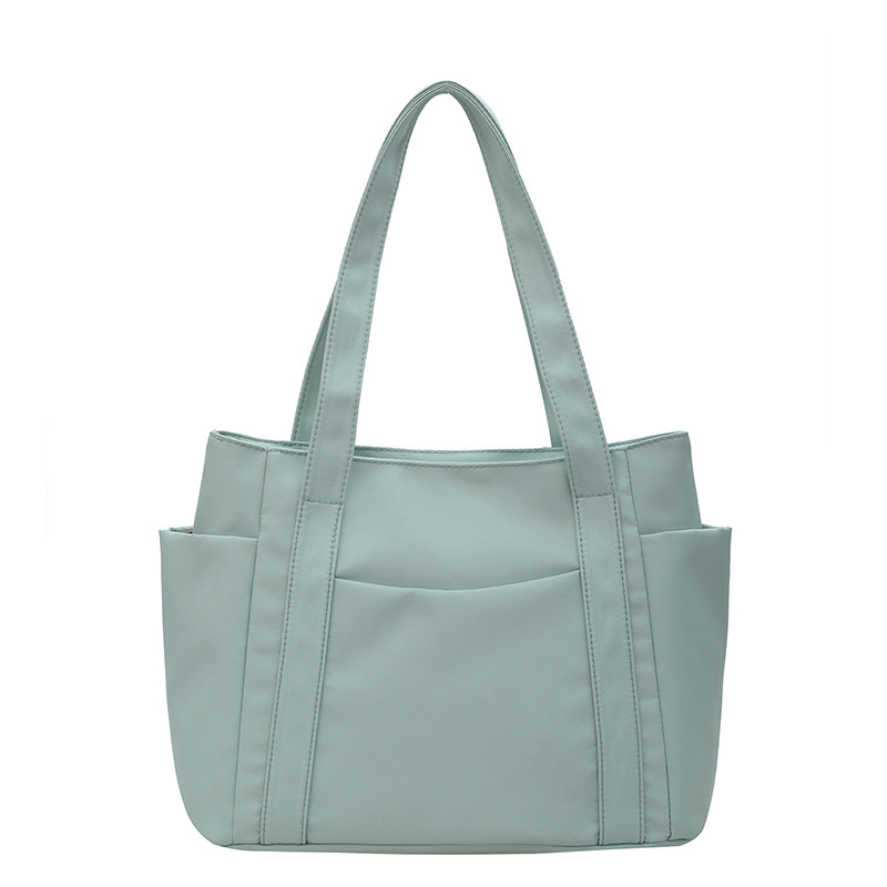 Bolso de gran capacidad para mujeres, nuevo estilo de moda, bolso de nylon, bolso de hombro casual, bolso de mano simple para mujeres.