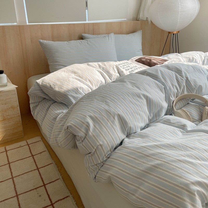 Una clase de algodón cuatro piezas de tejido de agua lavado sábanas de algodón cubierta dormitorio de estudiantes cama de tres piezas de impresión y teñido activo