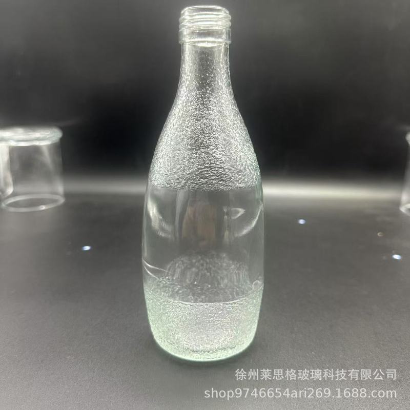 メーカー在庫卸売ミネラルウォーター飲料ガラスボトル透明ラウンドボトル空ボトル印刷可能なロゴ包装|undefined