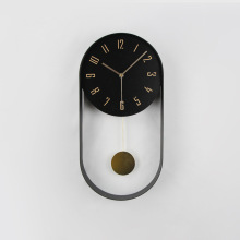 现代时尚椭圆形摆钟简约金属时钟客厅挂钟电子钟家用轻奢艺术摇摆
