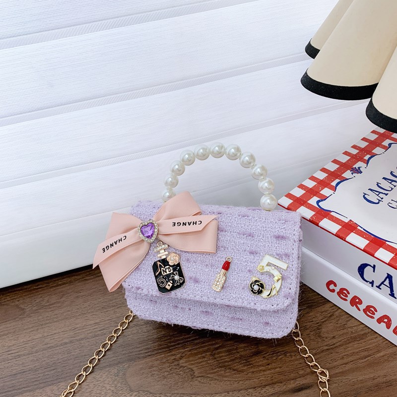 Bolso de cinturón para niños bolso de cambio pequeño viento perla de moda bolso de arco bolso de niña linda