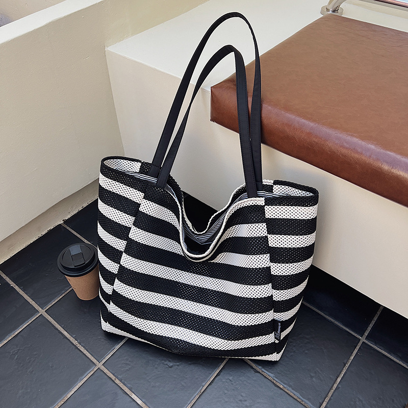 Bolso de vacaciones junto al mar 2025 nuevo bolso femenino de playa bolso de color de contraste a rayas bolso de hombro de punto de gran capacidad