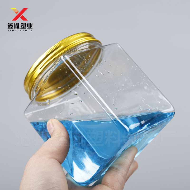 正方形のプラスチック缶 600 ミリリットルアルミ蓋ビスケット包装瓶ペットハンドル付きキャンディボトル 600 グラムナッツプラスチック缶|undefined