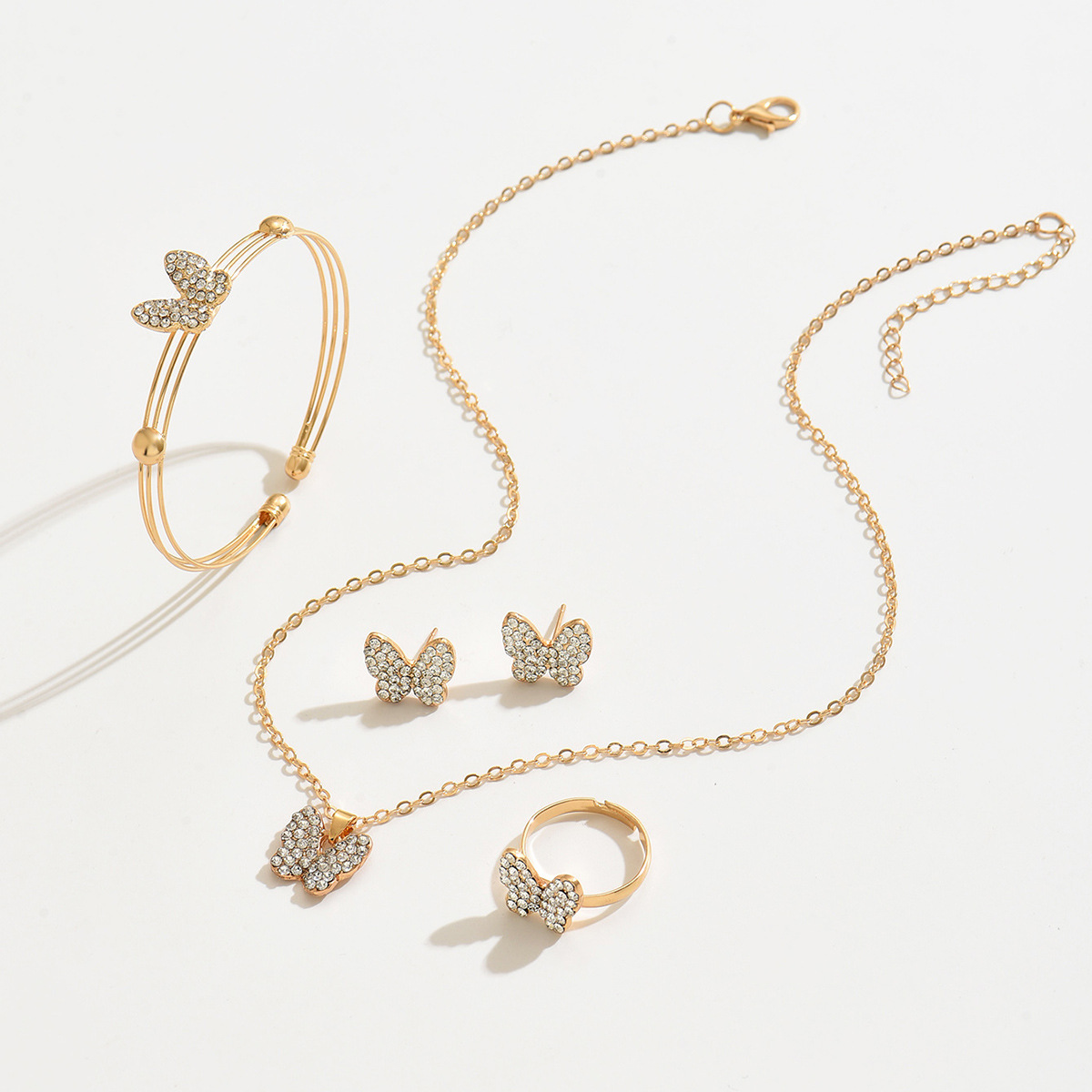 2024 juegos de joyería de venta cruzada mariposa pendientes brazaletes anillos pulseras collares de cuatro piezas juegos de relojes accesorios