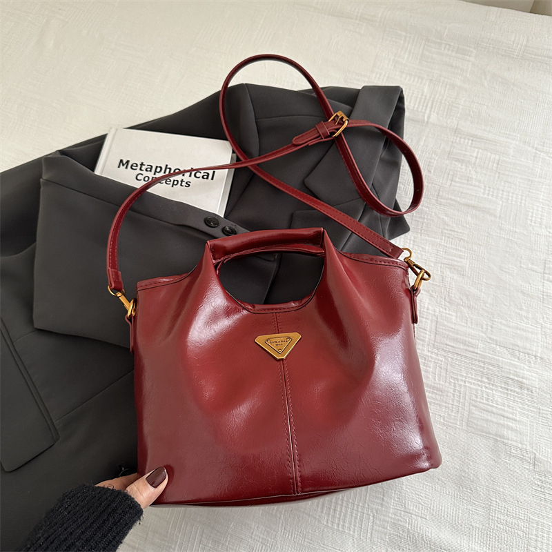 2024 alto valor retrógrado estilo de negocios Meillard bolso de cubo de mano de viaje versátil de invierno nuevo bolso de hombro