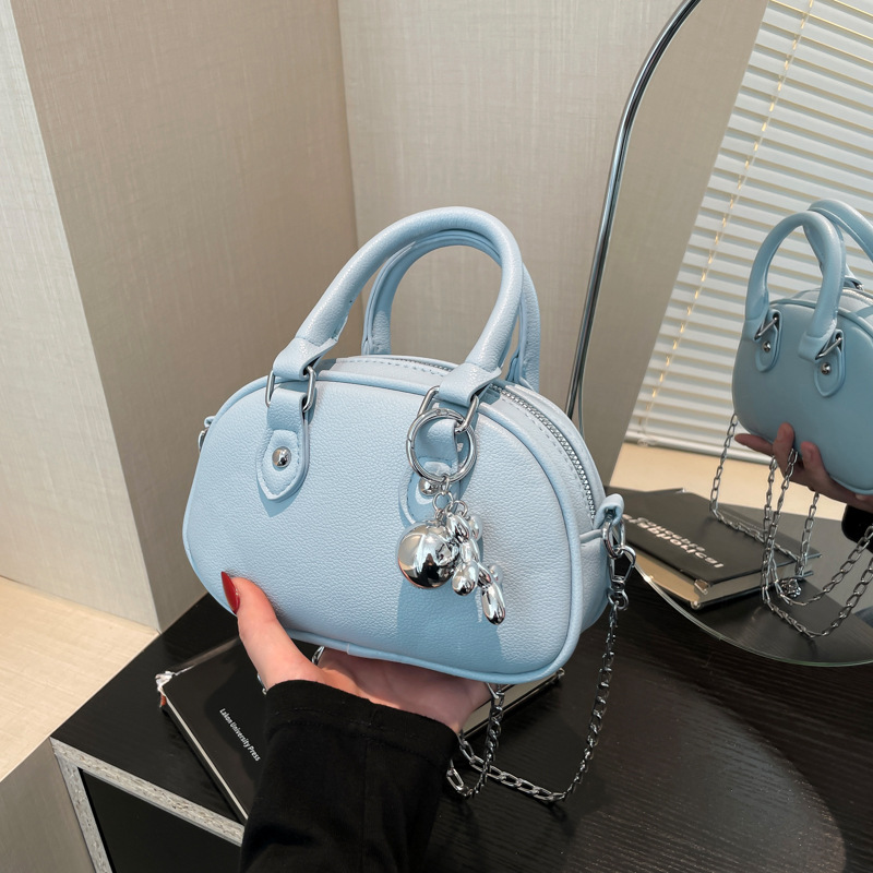 2024 nuevo temperamento diseño de moda bolso de hombro de color sólido estilo retro cremallera concha textura mochila