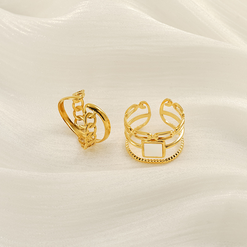 Nuevo anillo abierto geométrico hueco de lujo ligero europeo y americano transfronterizo, femenino, anillo de acero de titanio dorado de 18k, femenino