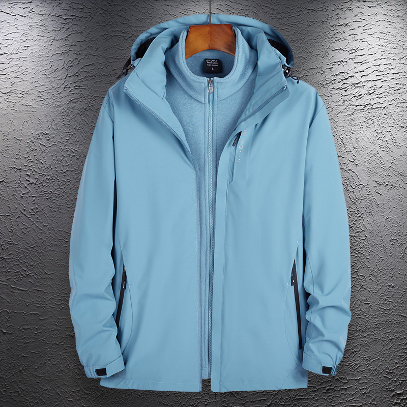 Lote de fábrica chaqueta de pareja al aire libre hombres y mujeres tres en uno traje de Montañismo de dos piezas desmontable traje de viaje de lana