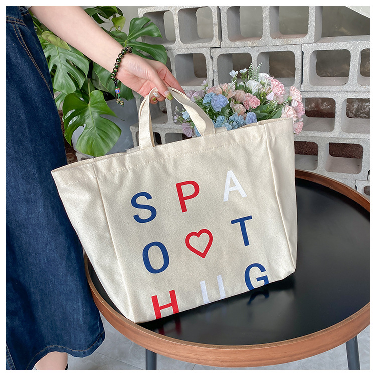A large-capacity, sturdy Japanese-style canvas bag for women, a new 2022 simple bento handbag for girls to go to work undefined