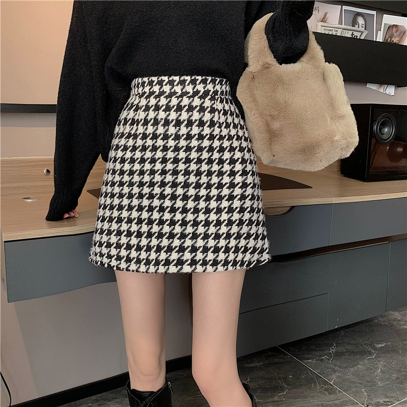 梨の形の体つきの大きいサイズの千鳥の格の毛の半身のスカートの女性の秋冬はセーターを配合して太っています。|undefined