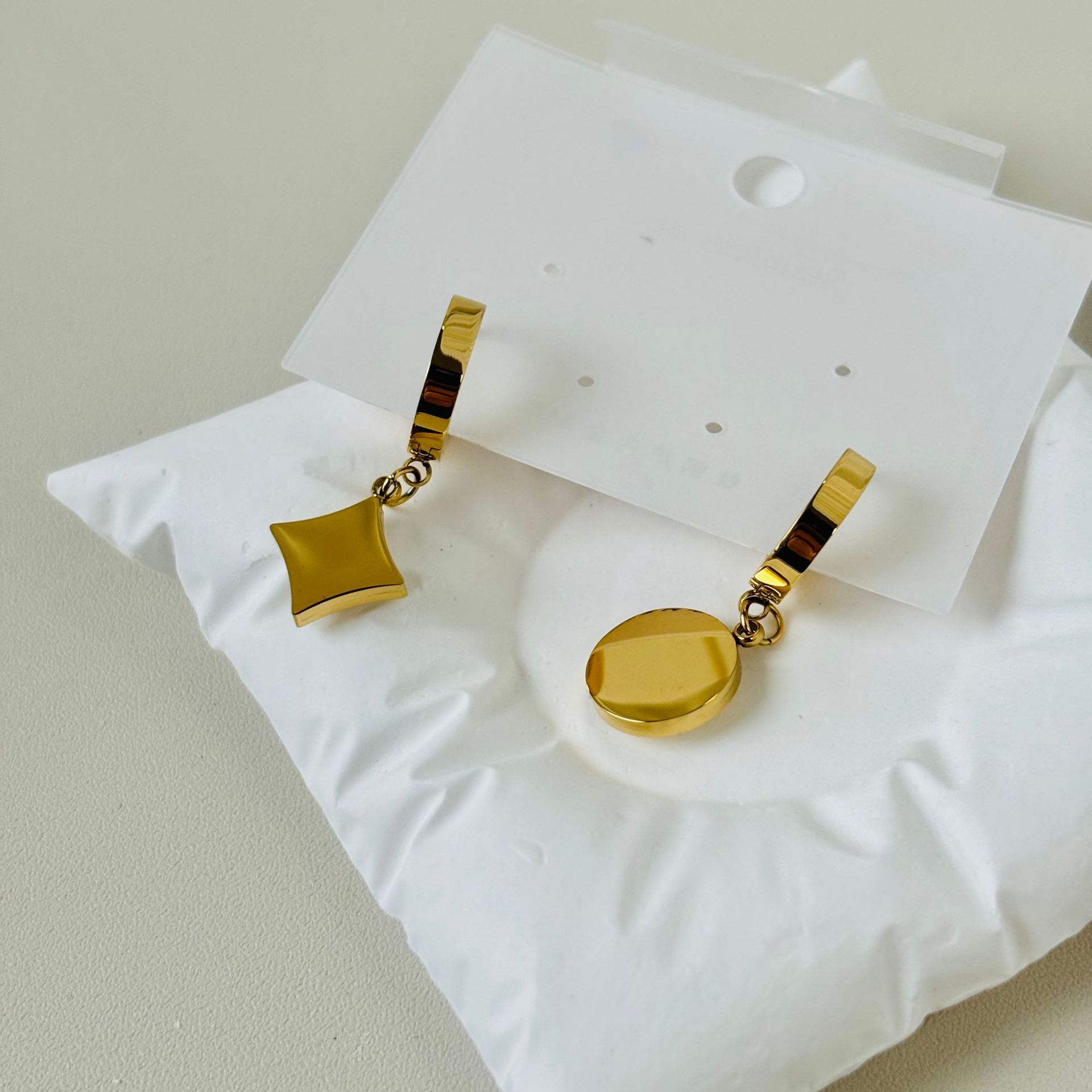 Golden asymmetrical earrings stainless steel