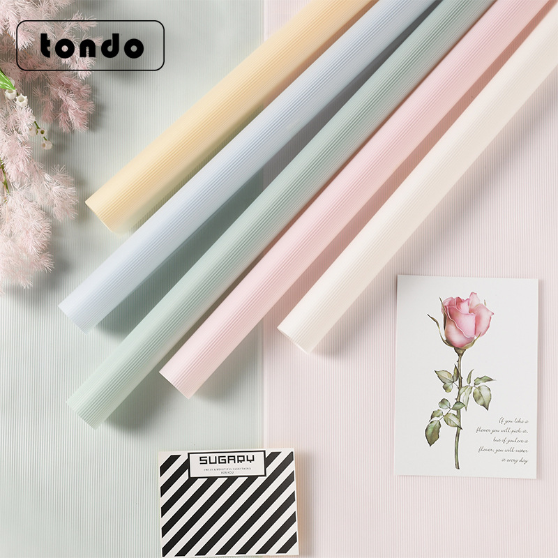 跨境专供鲜花包装纸雾霾线果冻膜半透纯色防水花束包花纸包装材料