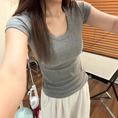 グレーの綿U襟の肩の半袖のtシャツの女性の夏のシンプルな百合のアメリカのギャルの修身はやせて腰の上着を収めます。