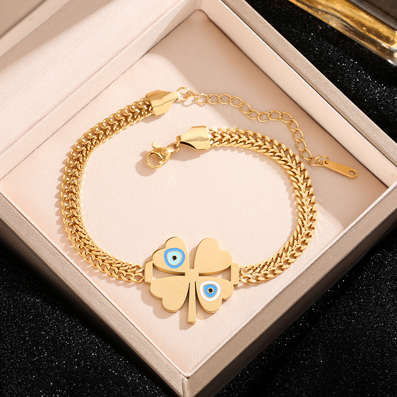 Amazon venta al por mayor transfronteriza Europa y América de moda ojos azules cuatro hojas colgante pulseras de acero joyas al por mayor