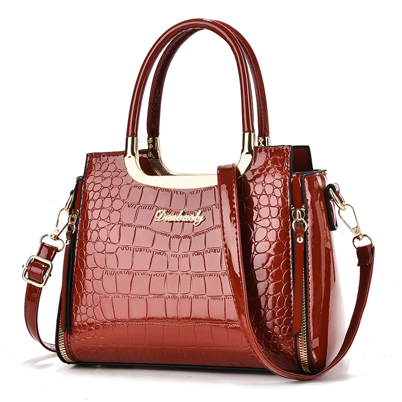2026 nueva moda esmaltada cocodrilo estampado bolso transfronterizo mujer universal viaje de gran capacidad mochila de hombro