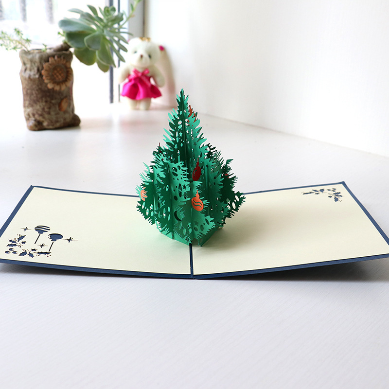 2021蓝封面3D立体纸雕镂空绿色圣诞树对折摆饰节日祝福语创意贺卡