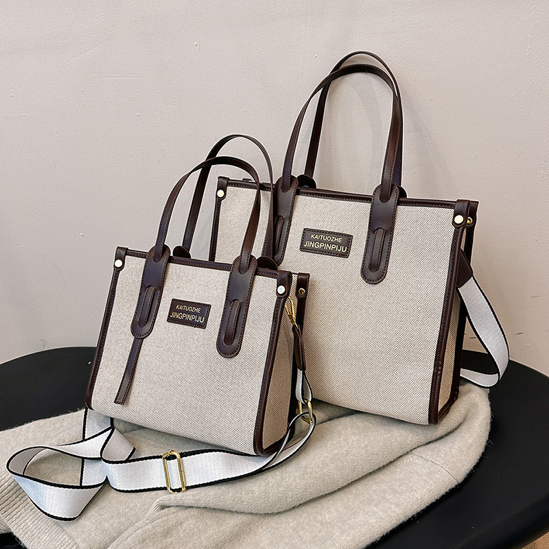 Bolso de mano de lona de color contrastante para mujer, nuevo estilo coreano transfronterizo, bolso de hombro tipo bandolera para ir al trabajo de alta gama