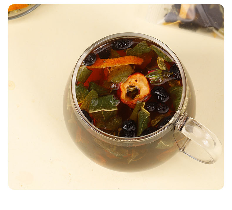Wumei Sangshen Sour Plum Herbal Tea 60 Tea Bags with Hawthorn Tangerine Peel Lotus Leaf and Rose in use