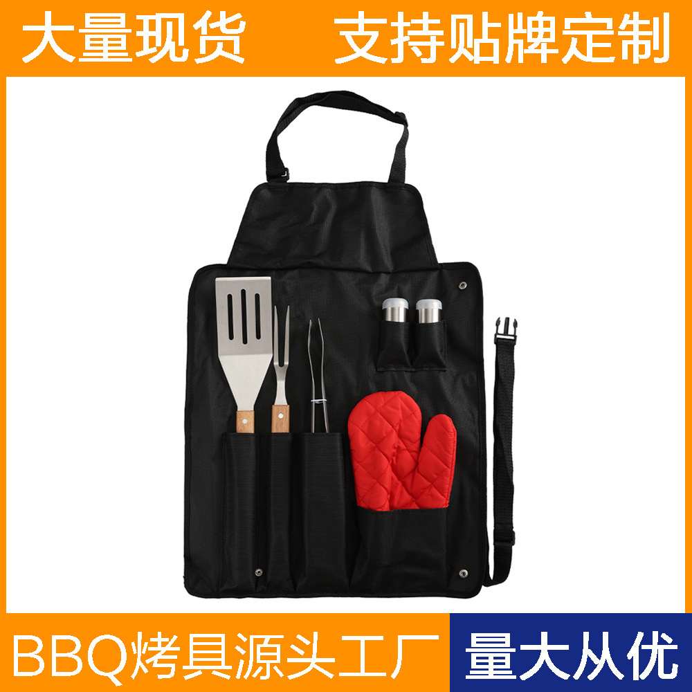 Venta caliente transfronteriza conjunto de herramientas de barbacoa al aire libre de acero inoxidable mango de madera clip de pala delantal bolsa de tela BBQ combinación de utensilios para hornear