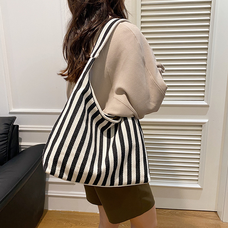 Bolso de lona de doble cara para mujeres 2024 nueva moda tote estriado bolso de hombro de gran capacidad perezoso bolso de mochila