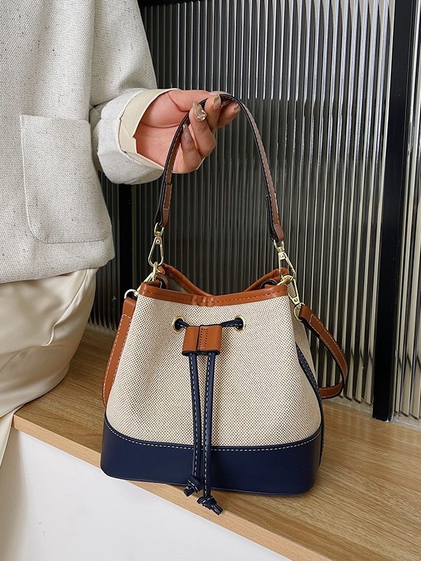 Bolso tote tipo cubo de lona con bloques de color para mujer, nuevo modelo de comercio exterior, bolso de hombro cruzado con cordón texturizado estilo moda urbana.