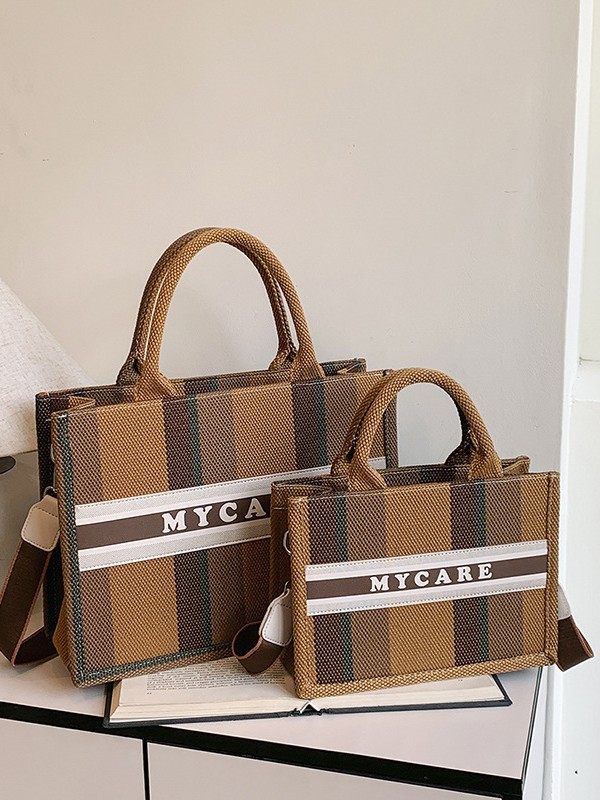 Bolso portátil de alta gama a rayas con sentido al por mayor transfronterizo logotipo personalizado nuevo casual todo-fósforo bolso de mensajero de gran capacidad