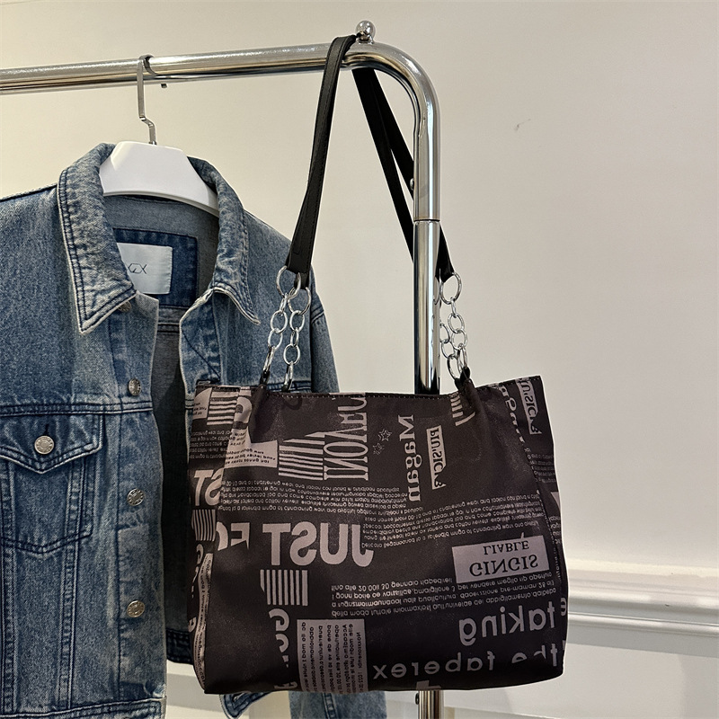 Bolsa de hombro de moda moda para mujeres 2025 nueva impresión de gran capacidad bolsa de mano simple de viaje bajo la axila