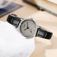 Women's stylish high-end wristwatch with a niche, sophisticated design—featuring a delicate fabric-texture dial and a chic quartz movement, complete with a trendy airplane-style second hand.