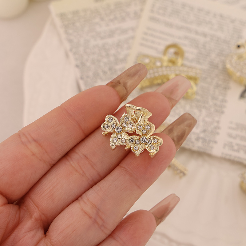 Clip pequeño de trébol doble de diamantes de imitación