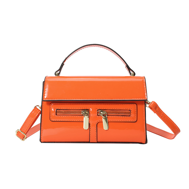 Bolso de diseño de nicho 2025 verano nuevo bolso femenino de alta calidad textura bolso de hombro charol brillante bolso de mensajero marea